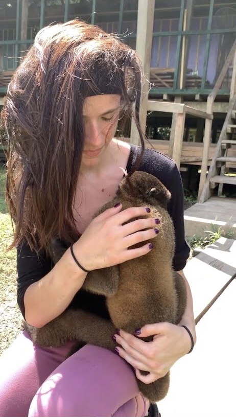 Spirituality Lifestyle Blog Author Brittany Brin holding a monkey